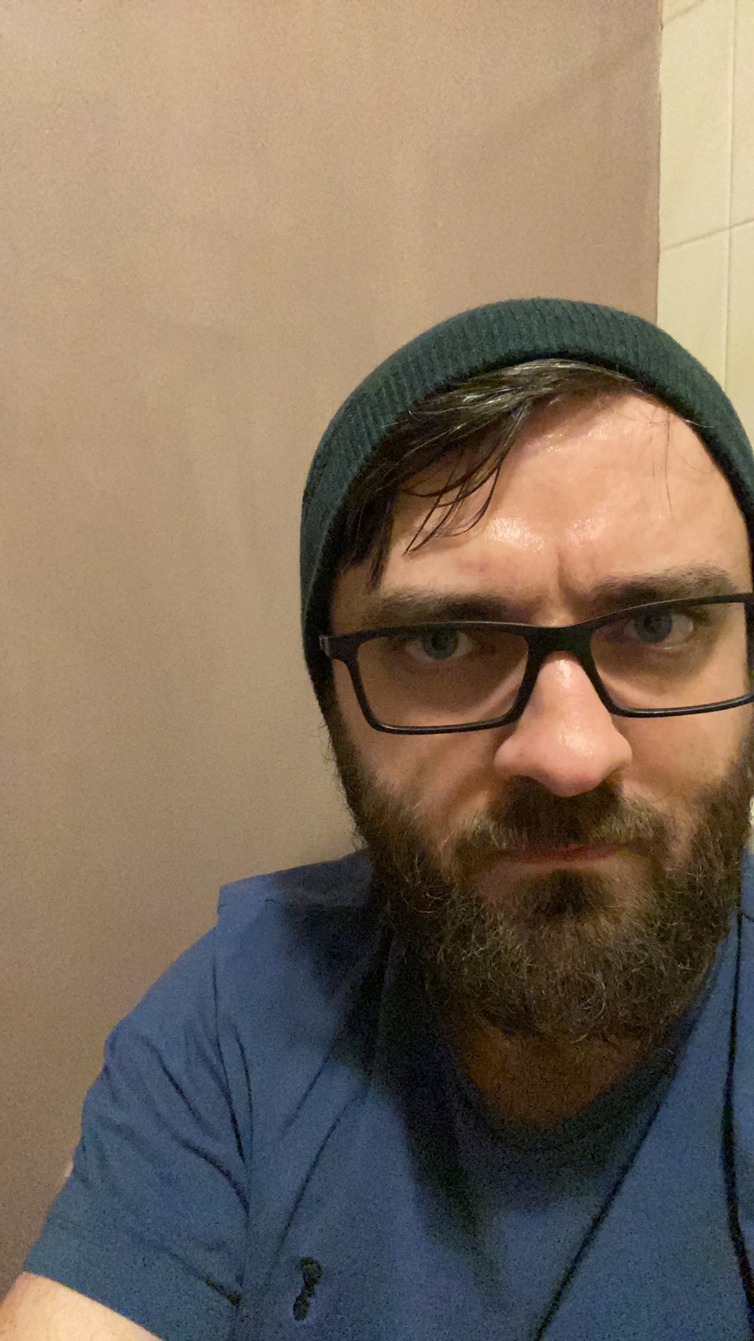 luke with a beard in a beanie and glasses
