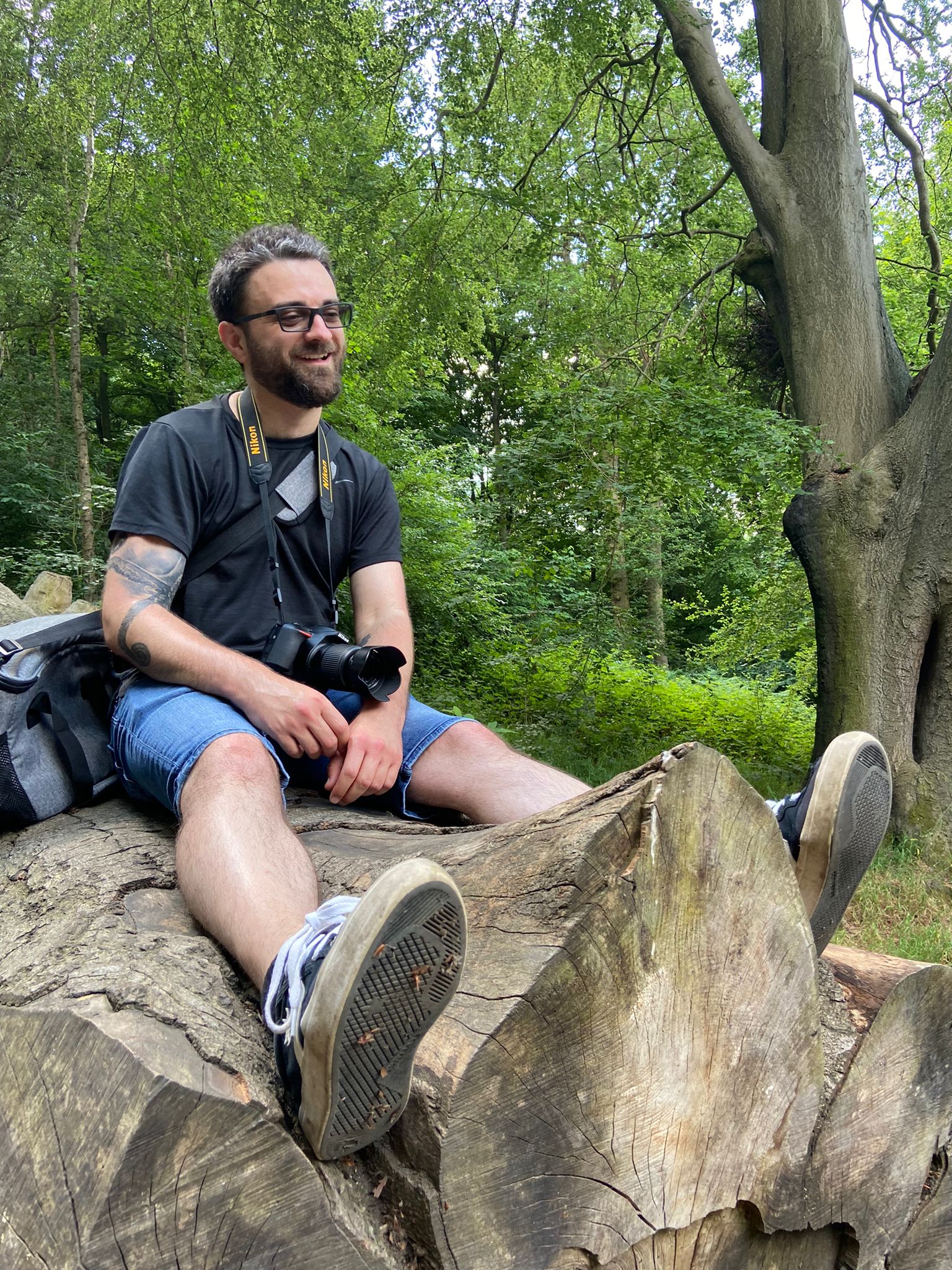 luke sat on a rock with a camera